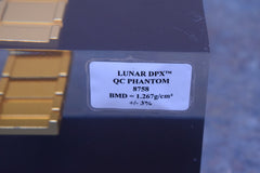 LUNAR DPX QC PHANTOM 8758 BMD = 1.267 G/CM3 +/- 3%